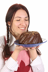 Image showing housewife  with bundt cake