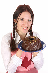 Image showing housewife  with bundt cake