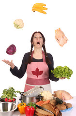 Image showing housewife juggling with fruit and vegetables