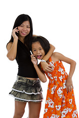 Image showing mother and daughter on the phone