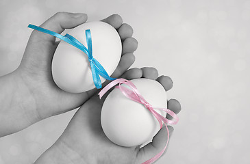 Image showing Children hands holding  Easter Eggs