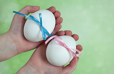 Image showing Children hands holding  Easter Eggs