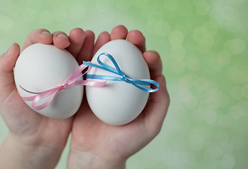 Image showing Children hands holding  Easter Eggs