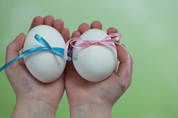 Image showing Children hands holding  Easter Eggs