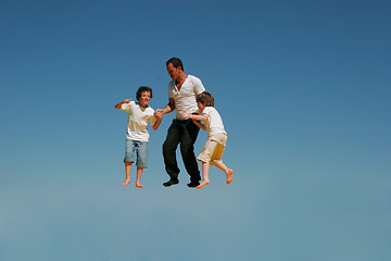 Image showing Father to play with two children