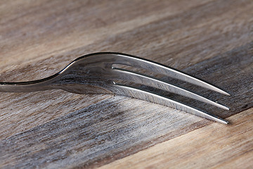 Image showing Steel Fork on wooden Table