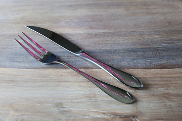 Image showing Steel Fork and knife on wooden Table