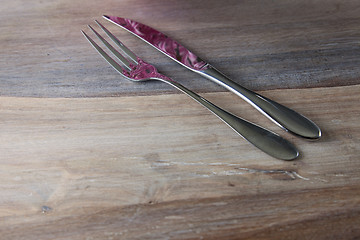 Image showing Steel Fork and knife on wooden Table