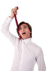 Image showing young business man to hang himself