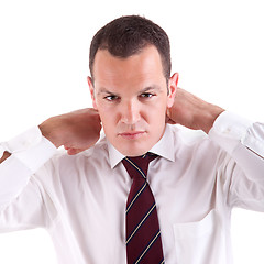 Image showing Businessman putting on tie