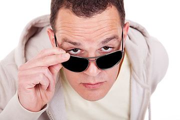 Image showing portrait of a young adult man looking over his sunglasses