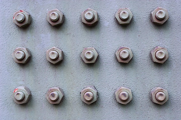 Image showing Nuts And Bolts On Iron Plate