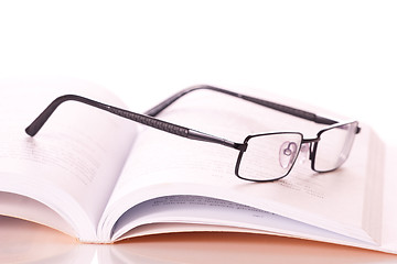 Image showing glasses on a book