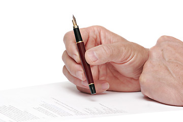 Image showing reading a document  with a fountain pen