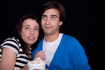 Image showing couple watching tv/cinema,  with popcorn
