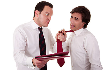 Image showing two businessmen discussing because of work, pointing to a document and pull the tie