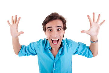 Image showing Portrait of a very happy young man with his arms raised, and hands open