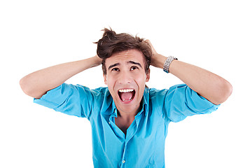 Image showing Strongly afflicted young man, screaming and pulling hair