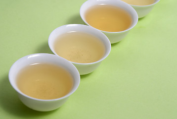 Image showing tea in cup in a row