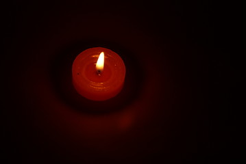 Image showing Candles burning in the dark