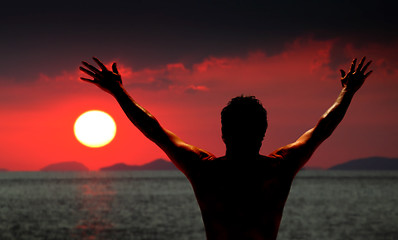 Image showing Man standing looking at ocean