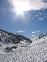 Image showing Sunshine over snowy mountains