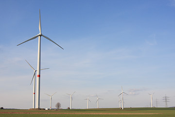 Image showing wind turbines under blue sky