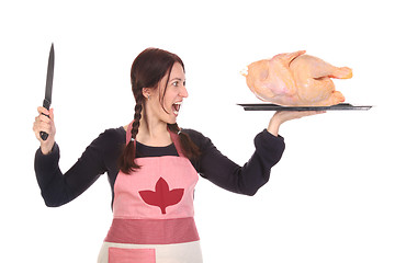 Image showing mad housewife with knife and chicken 