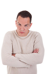 Image showing man upset with his arms crossed, isolated on white background. Studio shot.