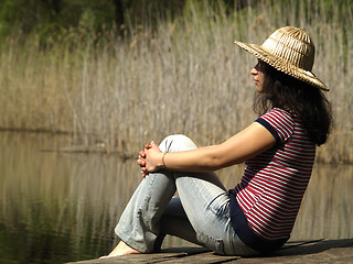 Image showing Girl resting near lake