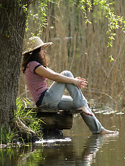 Image showing Girl resting near lake