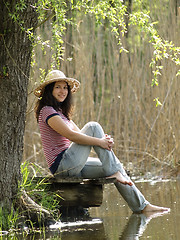 Image showing Girl resting near lake