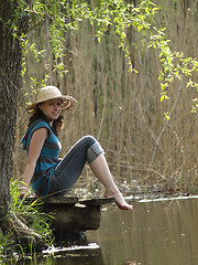 Image showing Girl resting near lake