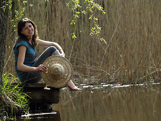 Image showing Girl resting near lake