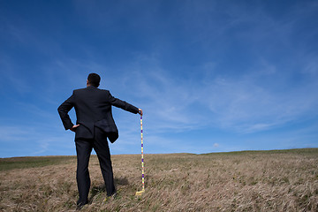 Image showing businessman cleaning the environment