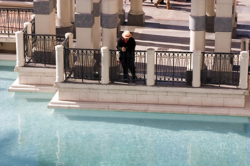 Image showing Gondolier Looking At the Water by the Dock