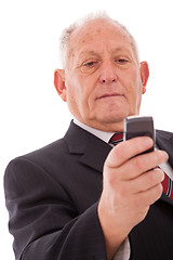 Image showing Senior sending a sms