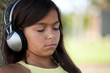 Image showing young child listening music