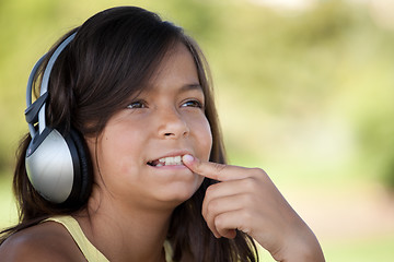 Image showing young child listening music