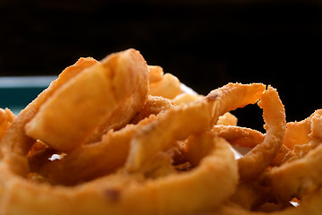 Image showing Close up on Onion Rings with Black Background