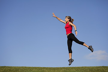 Image showing Running at the top of the hill