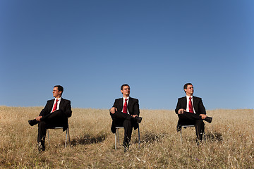 Image showing Three businessman at the field