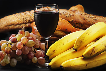 Image showing Red wine with fruits and pastry