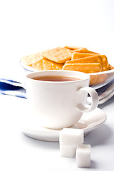 Image showing cup of tea, sugar and cookies