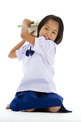 Image showing cute girl throwing a book