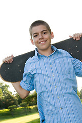 Image showing Teenager with His Skateboard