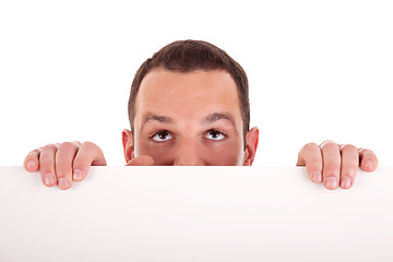 Image showing Man holding a white board, looking to camera, isolated on a white background.