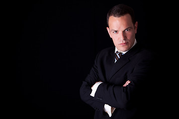 Image showing Portrait of a  business man isolated on black background. Studio shot.