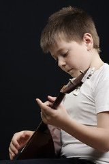 Image showing Kid playing balalaika