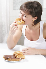 Image showing Woman biting cake